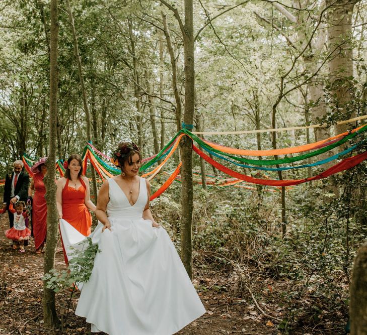 forest wedding ceremony bridal entrance in David's Bridal gown