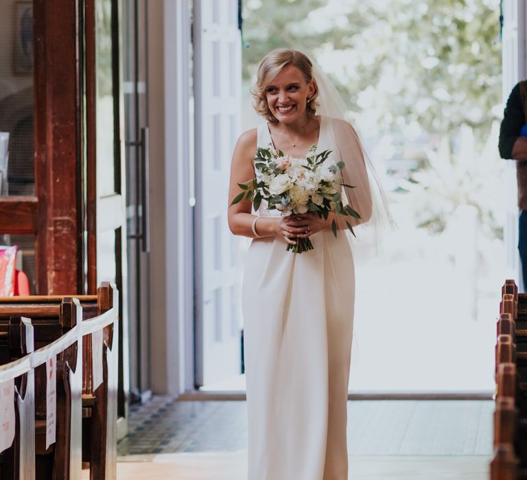 church wedding ceremony bridal entrance in white by Vera Wang wedding dress