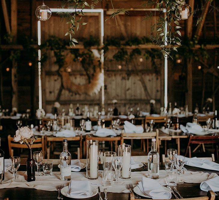 Table decor with bottles and candle centrepieces 