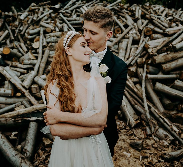 Portrait of stylish bride and groom embracing 