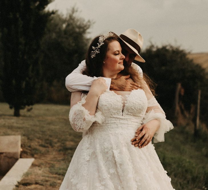 Bride and groom hug in Tuscany