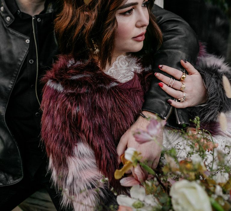 Bride in deep purple jacket and golden crown