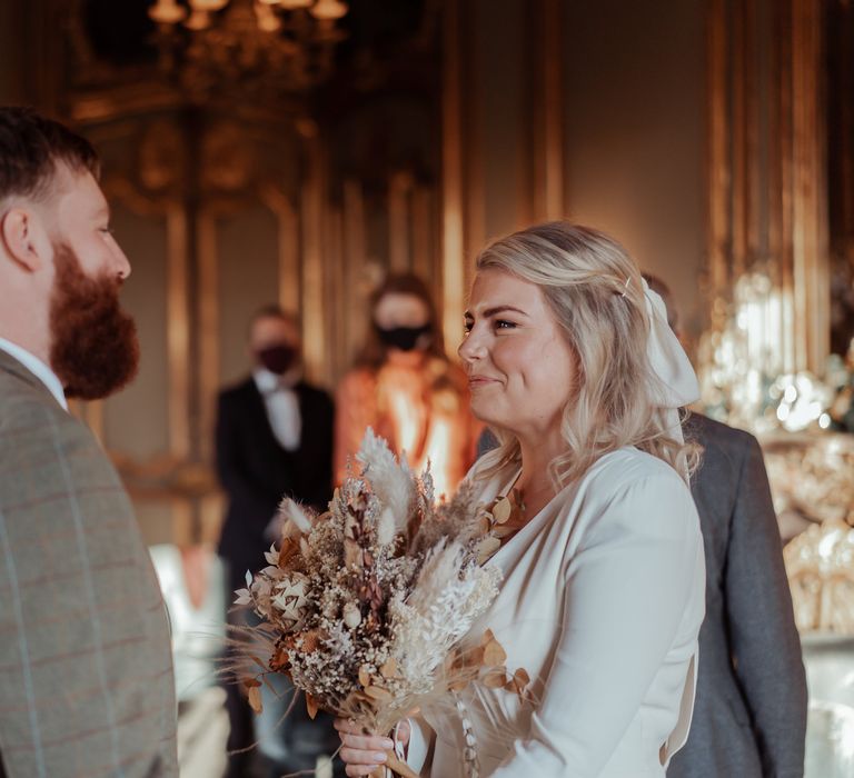 Bride & groom look at one another during ceremony