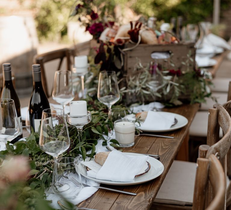 Place settings with crisp white table wear and cut glasses 