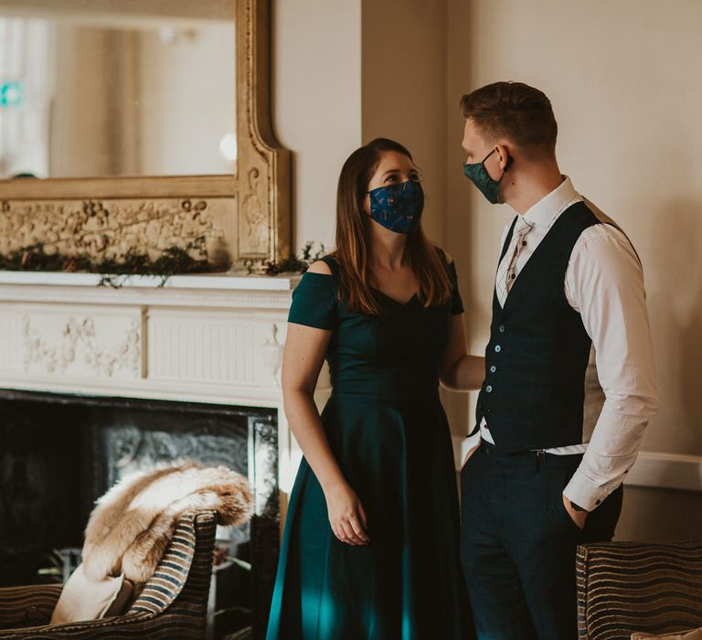 Wedding guests in face masks at micro wedding 