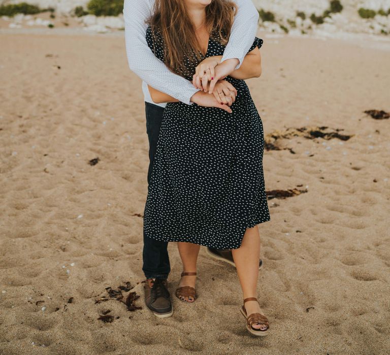 Playful engagement shoot photography at the beach in Dorset