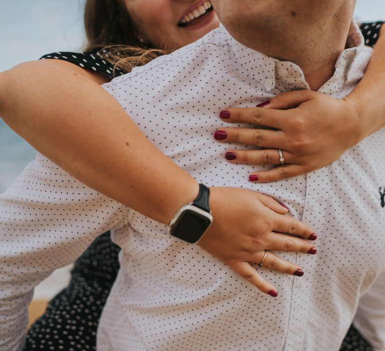 Bride to be hugging her husband to be for engagement photoshoot