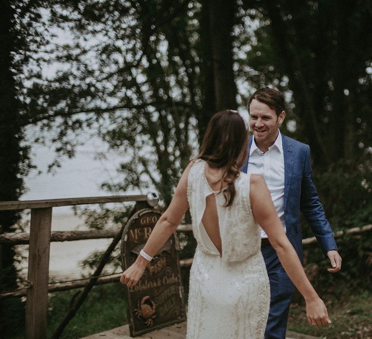 Groom sees bride for the first time during first look moment on their wedding day