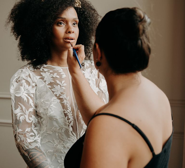 Bride has her makeup done naturally on the morning of her wedding day