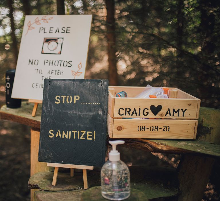 Sanitising station with wedding signs and wooden box 