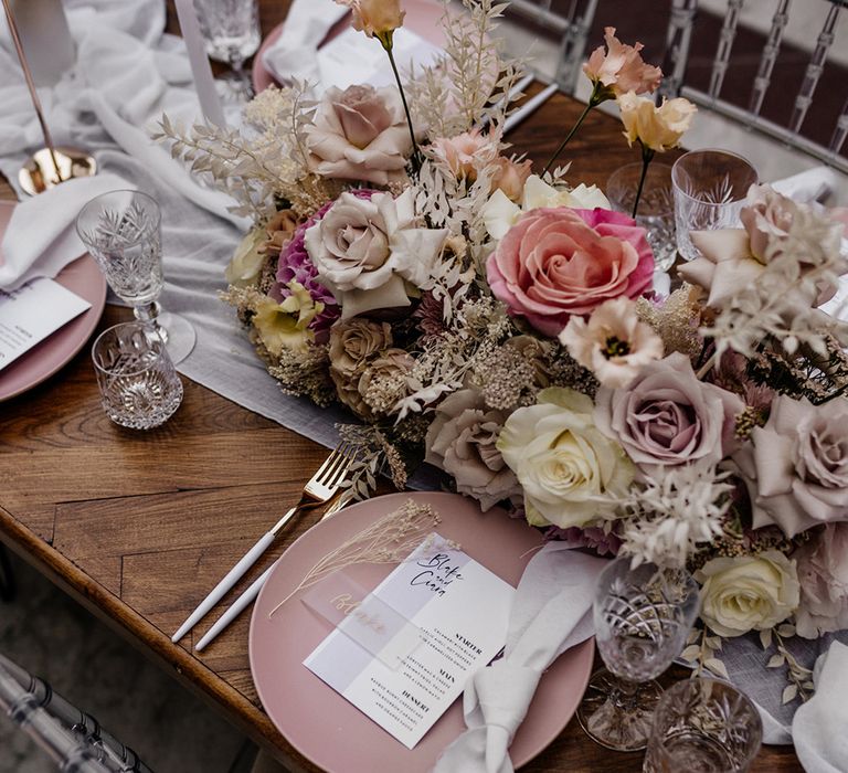 Place setting with pink tableware, cut glass, perspex table name ad menu card 