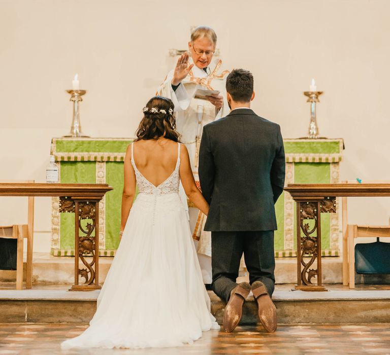 Bride & groom at the altar during their wedding day ceremony