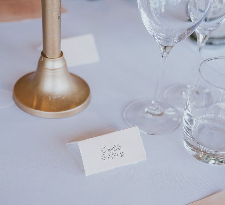 White wedding breakfast table with calligraphy table place names on white card and pink wedding menu for summer wedding at Primrose Hill Farm