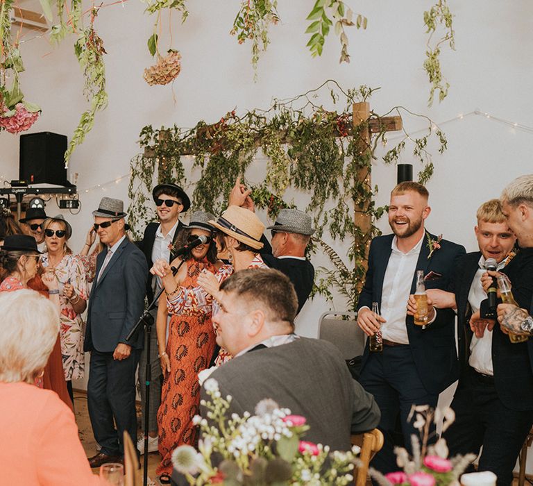 Wedding guests dance during reception on wedding day