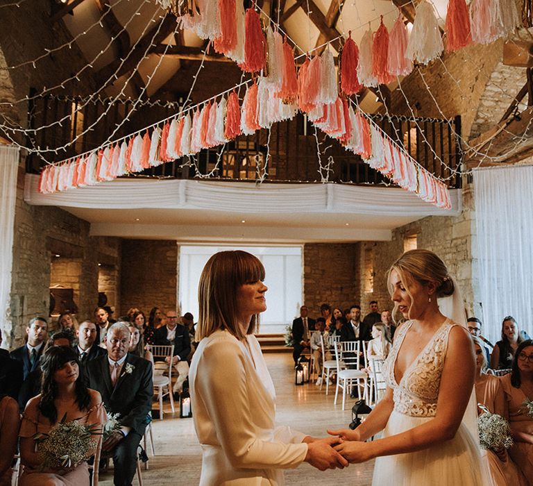 DIY tassel decor for lesbian wedding at barn venue