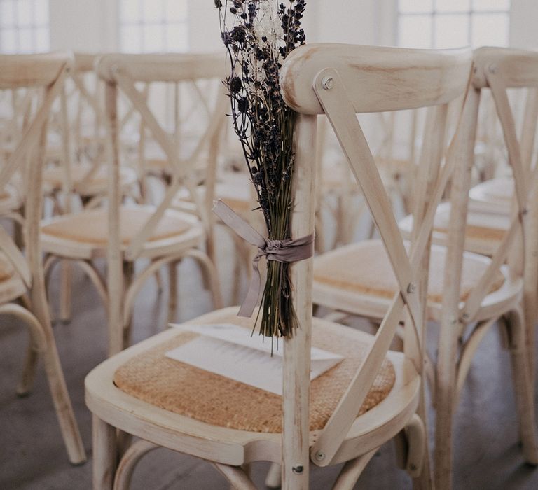 White distressed chairs complete with lavender decor