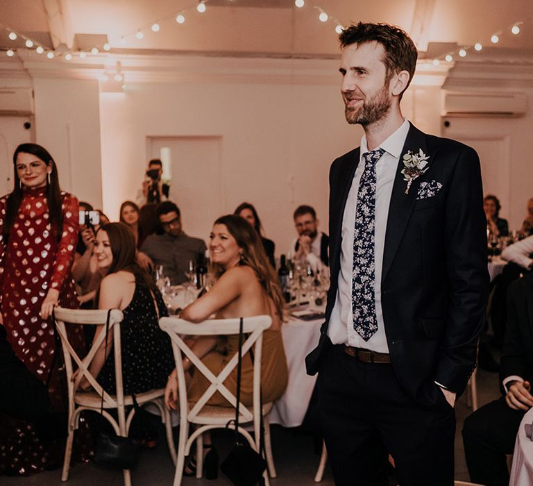 Wedding guests listen during speeches at the Core Clapton