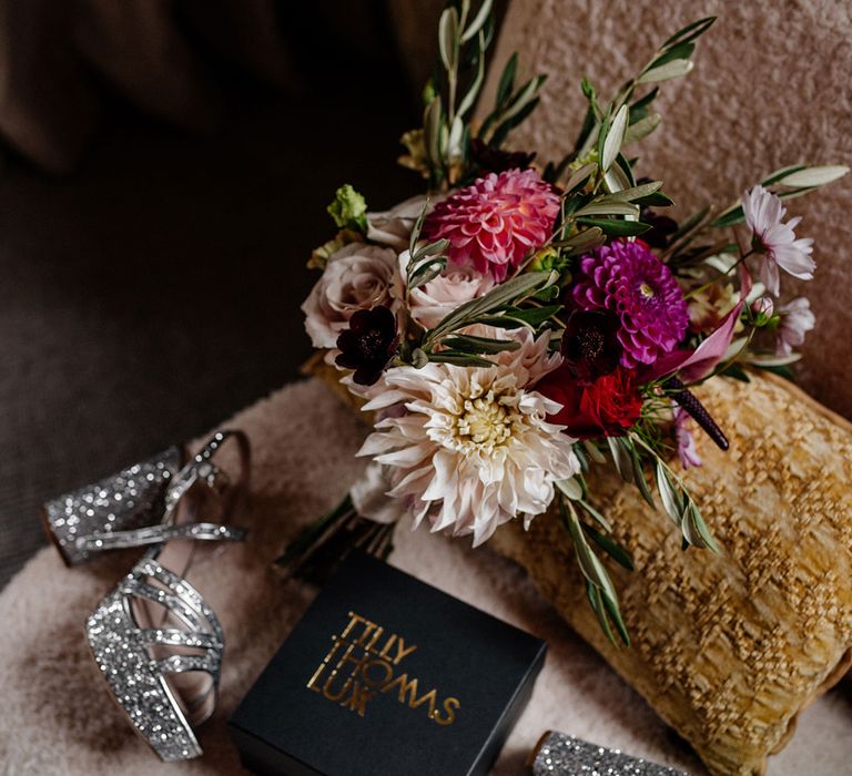 Sparkly silver platform Miu Miu platform wedding shoes and pink bridal bouquet 