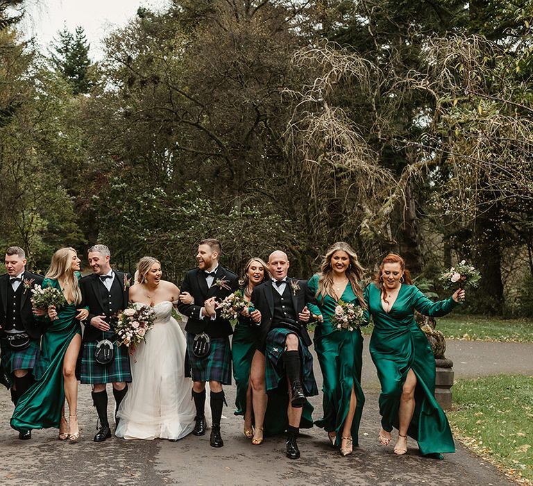 Wedding party look stunning with bride and groom, groomsmen and bridesmaids with a green theme 