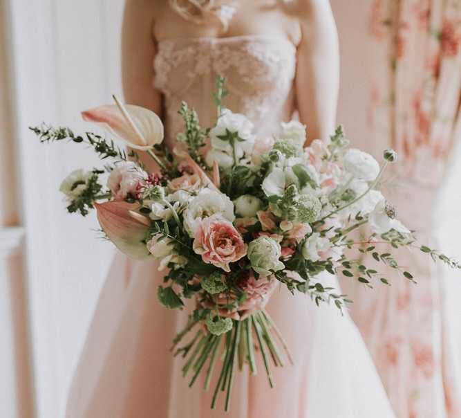 romantic pink, white and green wedding bouquet with anthuriums, anemones and peony tulips 