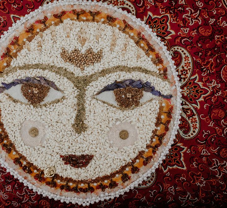 Different spices and rice created into a face for Sofreh Aghd 