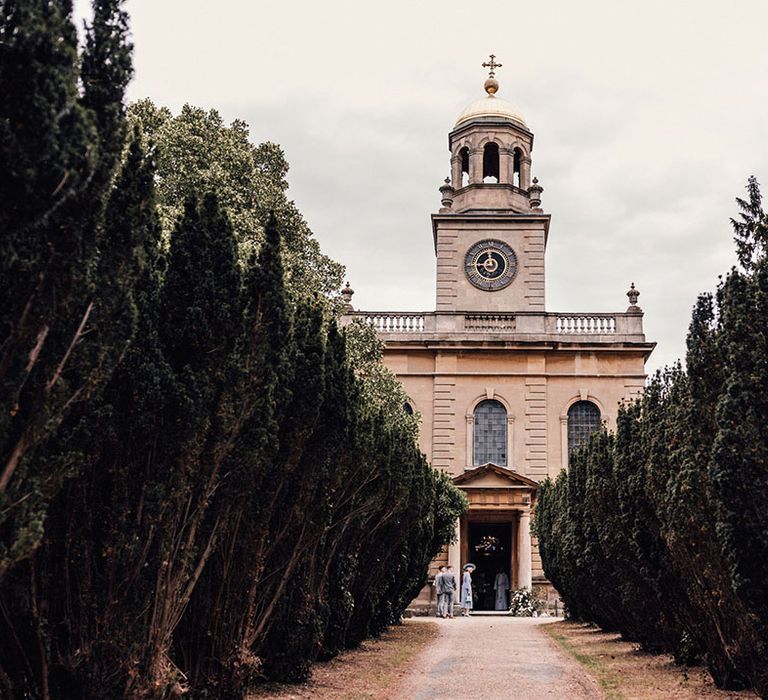 The grand and traditional Witley Court Church for the church ceremony for the bride and groom's classic wedding 