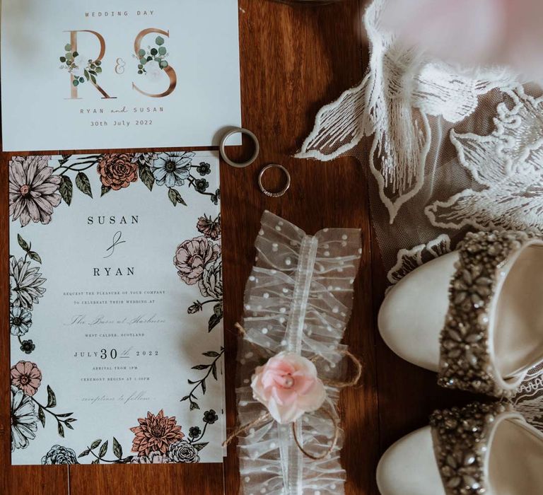 Modern luxe wedding stationery with botanical line drawings, wedding rings, polka dot tulle fabric and garden roses 