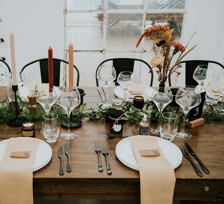 wedding table decorations with black industrial chairs 