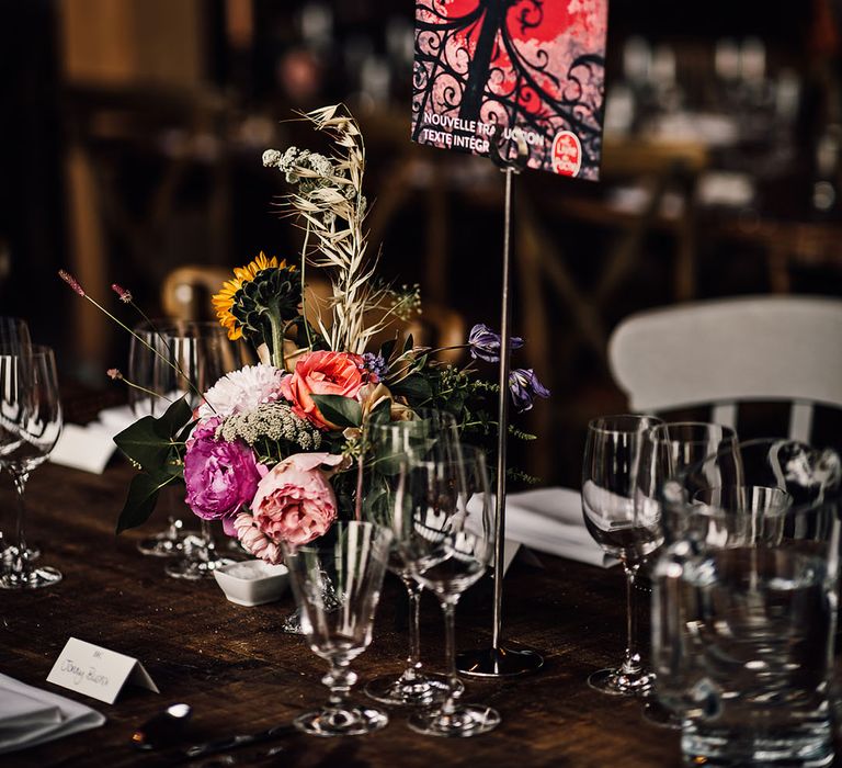 Barn wedding venue with tables named after classic literature including Rebecca by Daphne du Maurier 