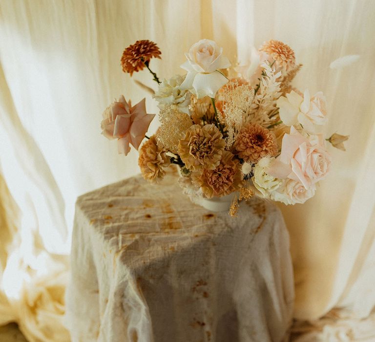 peeled back roses and muted flower arrangement