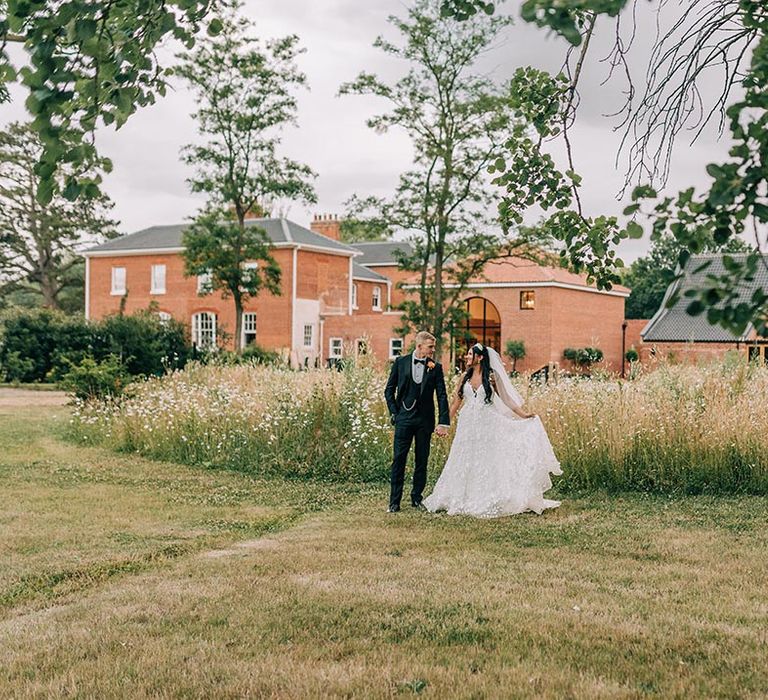 The bride and groom at their Reymerston Hall country house wedding 