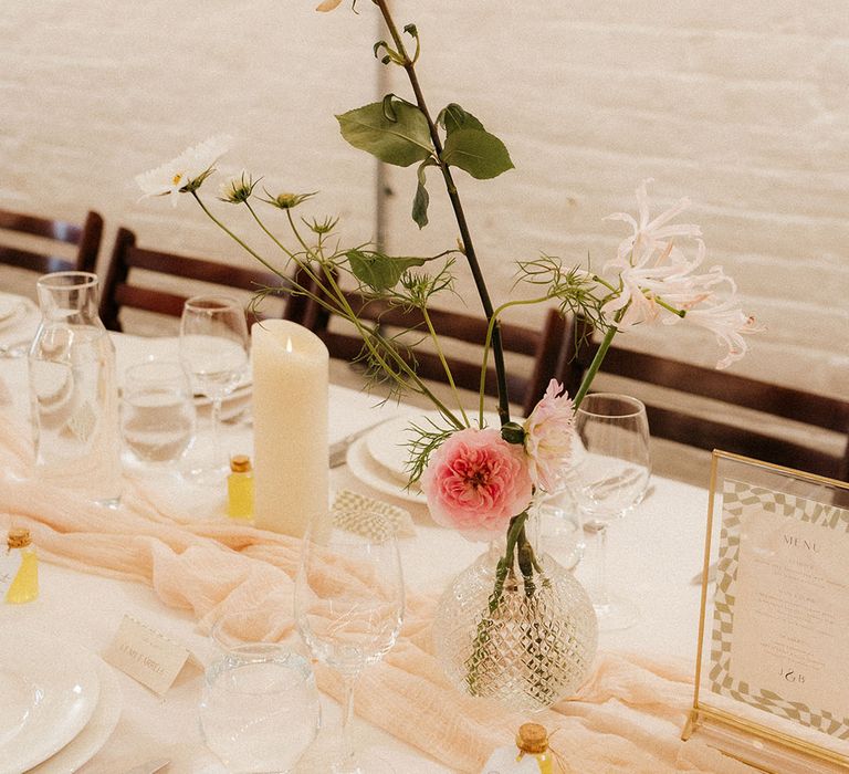 Simple retro glam wedding table decorations with neutral and pink wedding flowers 