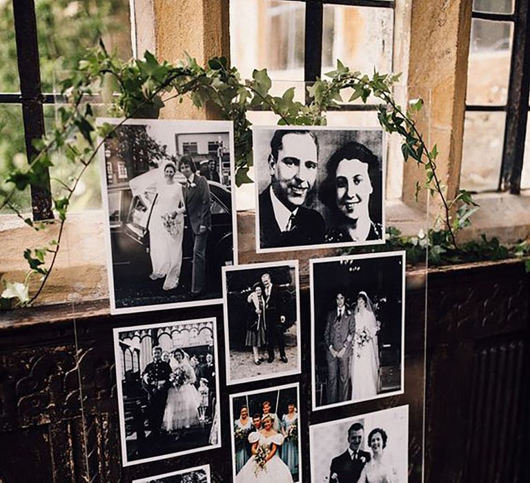 Display of monochrome family photos alongside wedding guest book to sign