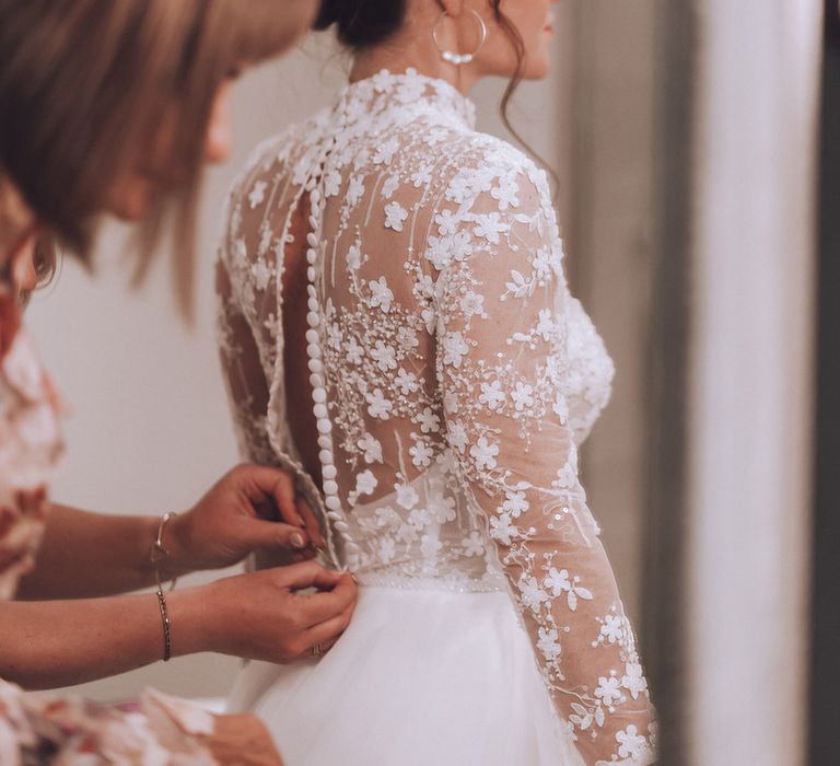 Bride in sheer flower high neck long sleeve wedding dress 