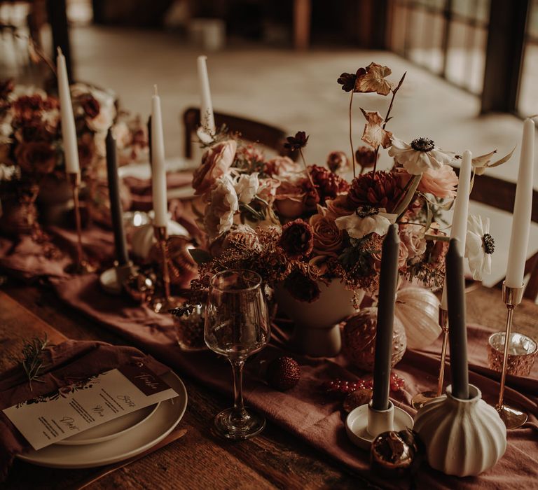 autumn wedding table decor with table runner, flowers and taper candles 