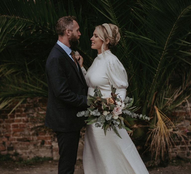 Romantic wedding bouquet with eucalyptus and roses 