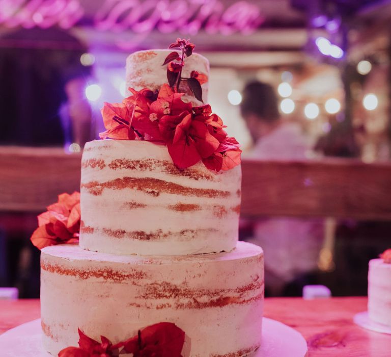 Semi-naked wedding cake at pink and blue wedding