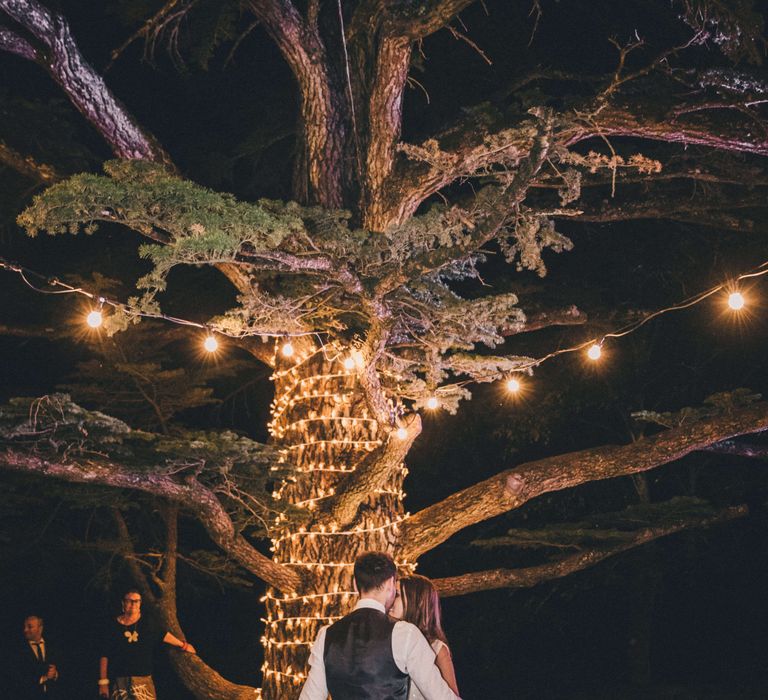 Italy Wedding first dance with lit up tree in Tuscany