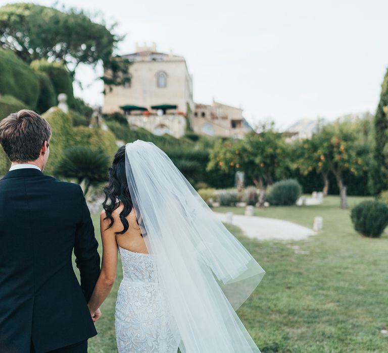 Bride in embellished lace wedding dress by Lee Petra Grebenau