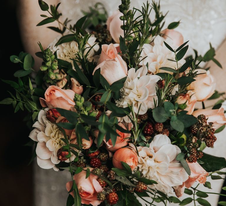 Floral bouquet with pale pink tulips and green foliage 