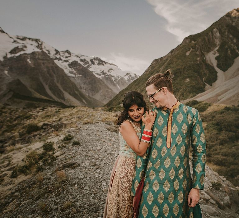 The bride and groom looked stunning in their traditional Indian wedding outfits on Mount Cook