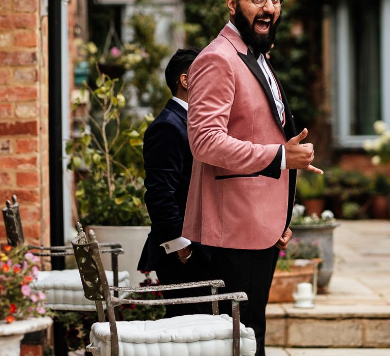 Groom wears pink Topman suit on wedding day