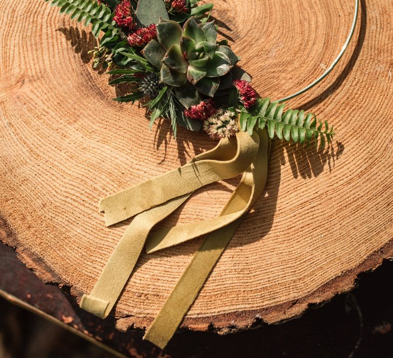 Floral decor on tree with golden ribbon