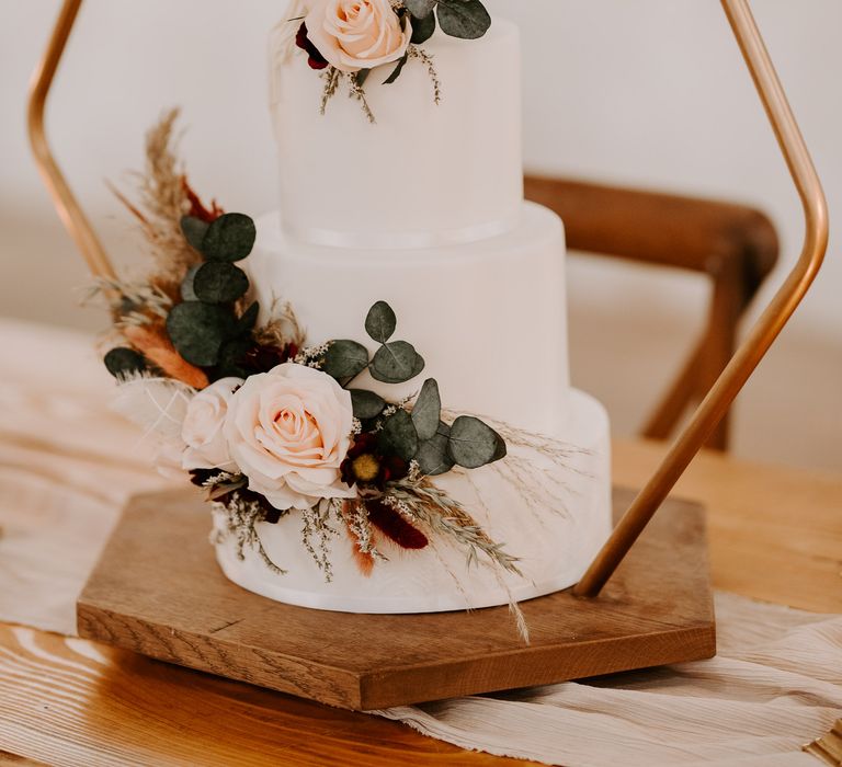 White wedding cake with macrame effect icing details