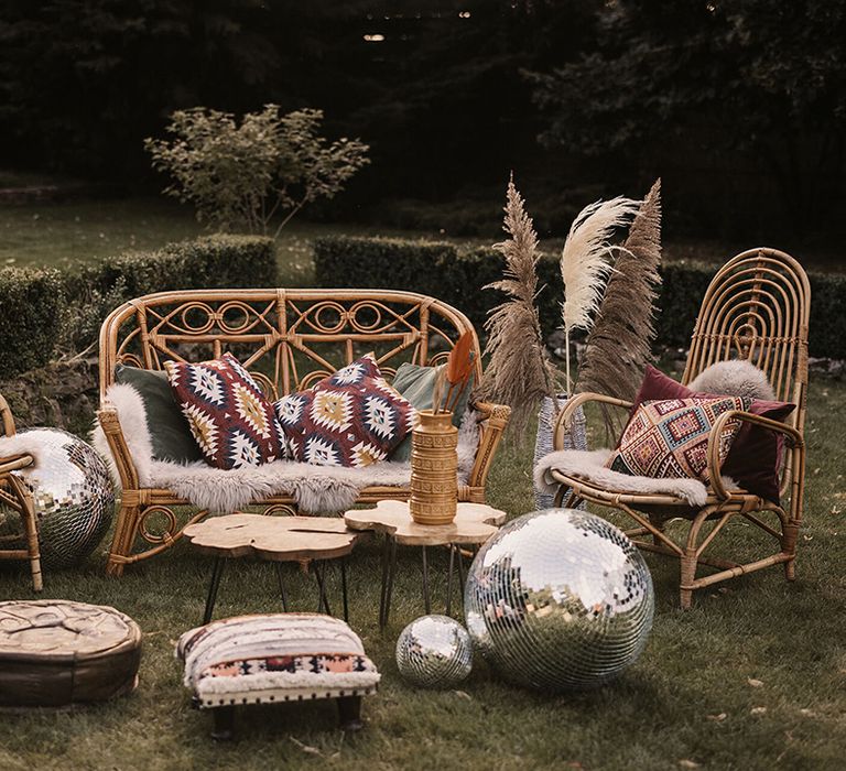 Outdoor seating area complete with disco balls on wedding day