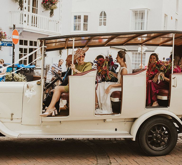 Bridal party arriving in a tuktuk wedding car 