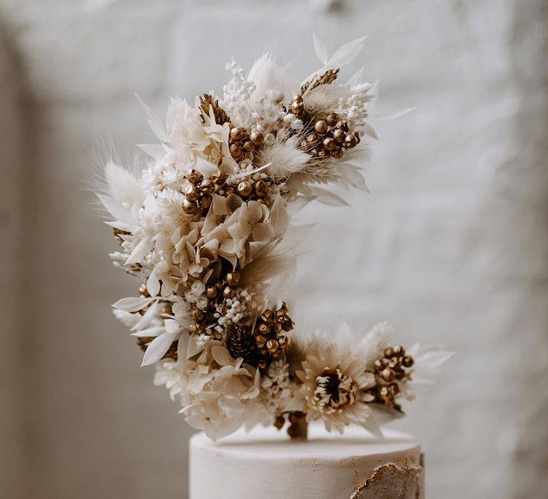 beige and bronze celestial wedding cake topper 