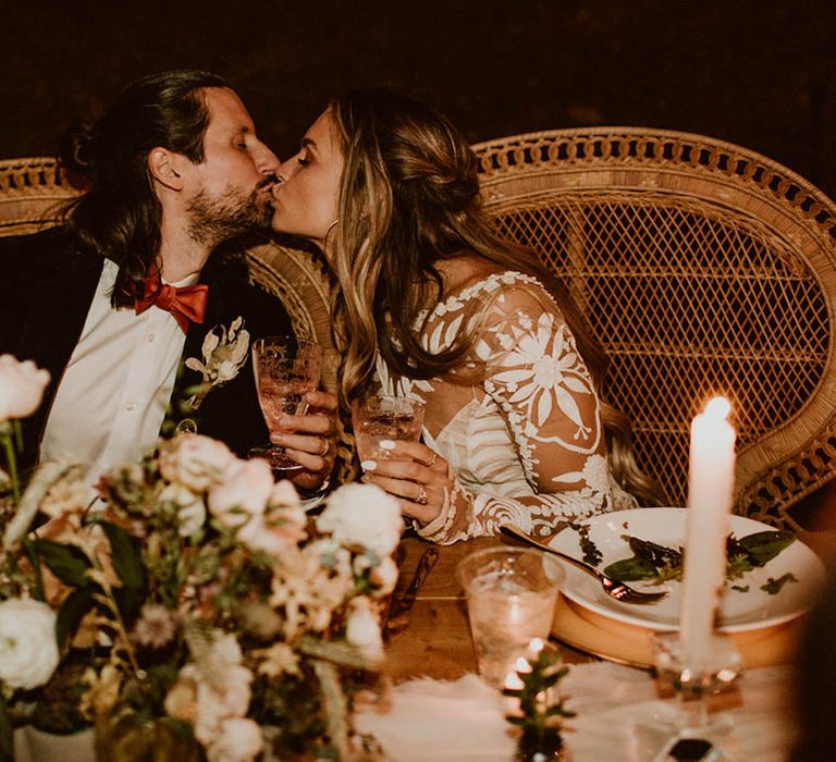 Bride & groom kiss during reception