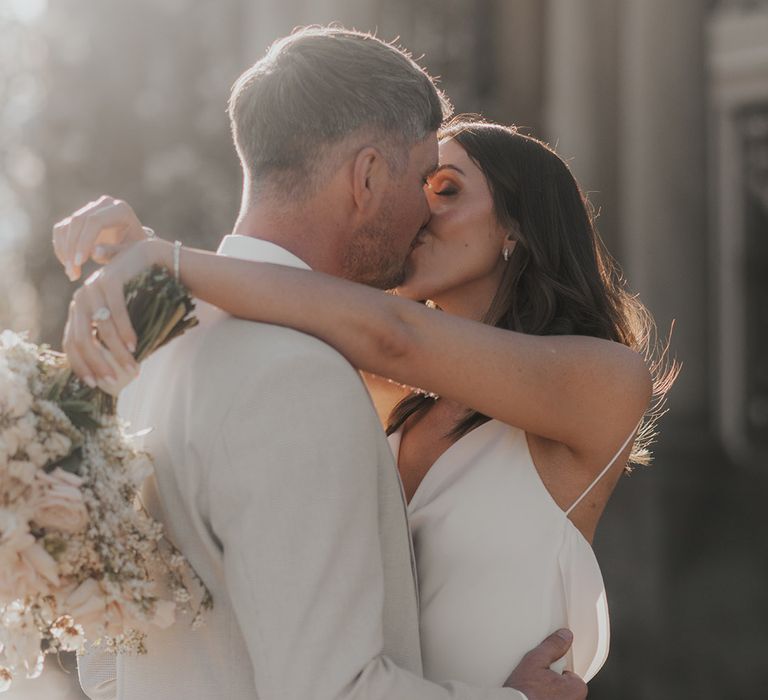 Bride and groom share a kiss