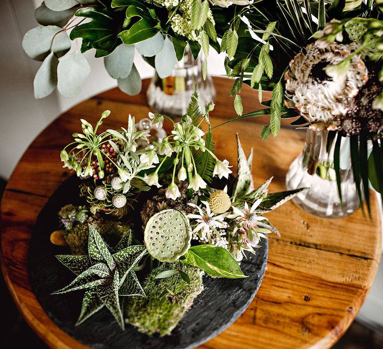 Botanical floral arrangements on wooden table 